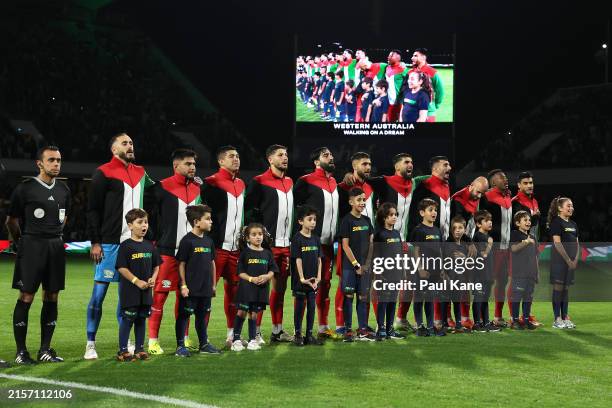 Palestinian players line up for the national anthem during the Second Round FIFA World Cup 2026 Qualifier match between Australia Socceroos and...