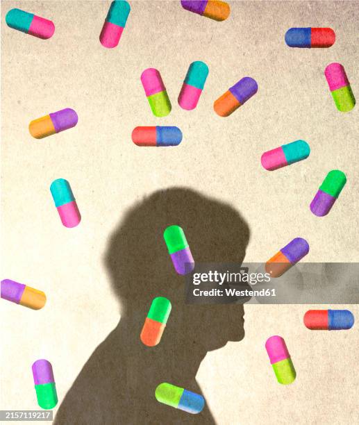 illustrations, cliparts, dessins animés et icônes de colorful capsules falling against shadow of person - abus de stupéfiants