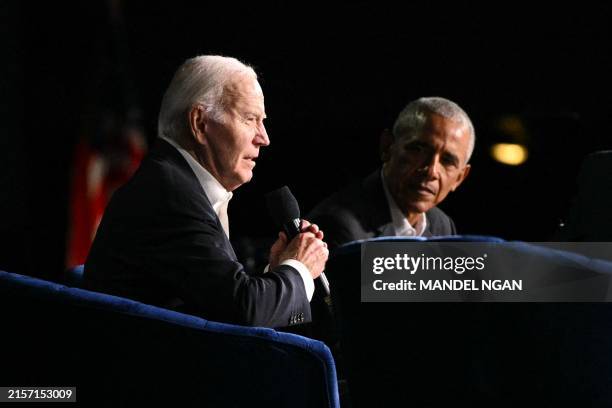 President Joe Biden speaks next to former US President Barack Obama onstage during a campaign fundraiser at the Peacock Theater in Los Angeles on...