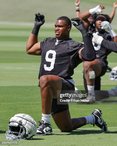 Defensive end Tyree Wilson of the Las Vegas Raiders stretches during mandatory minicamp at the Las Vegas Raiders Headquarters/Intermountain...