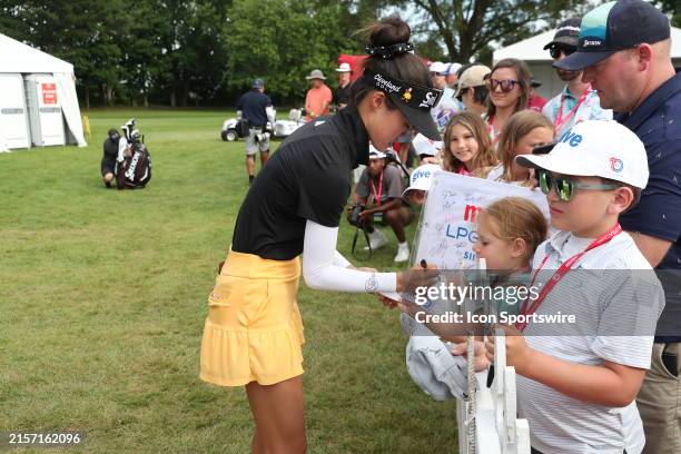 Golfer Grace Kim signs autographs for the fans after finishing her third round during LPGA Meijer LPGA Classic for Simply Give on June 15th at...