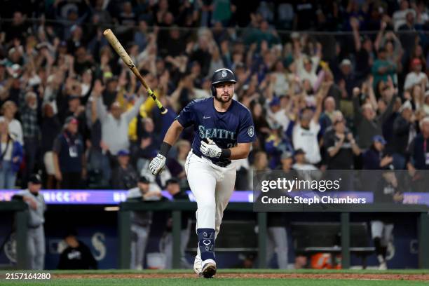 Cal Raleigh of the Seattle Mariners celebrates his walk-off grand slam to beat the Chicago White Sox at T-Mobile Park on June 10, 2024 in Seattle,...