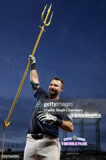 Cal Raleigh of the Seattle Mariners celebrates his walk-off grand slam to beat the Chicago White Sox at T-Mobile Park on June 10, 2024 in Seattle,...