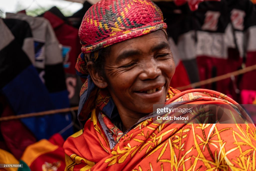Malagasy men laughing at the farmer's market