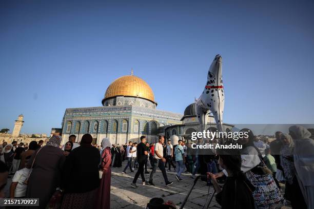Palestinians exhange Eid al-Adha greetings and attend festivities at the Al Aqsa complex in Jerusalem on June 16, 2024.
