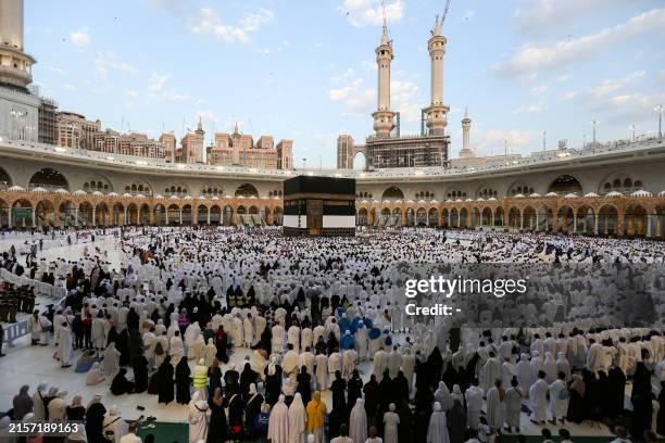 Muslims perform the Eid al-Adha morning prayer around the Kaaba, Islam's holiest shrine, at the Grand Mosque in Saudi Arabia's holy city of Mecca, on...