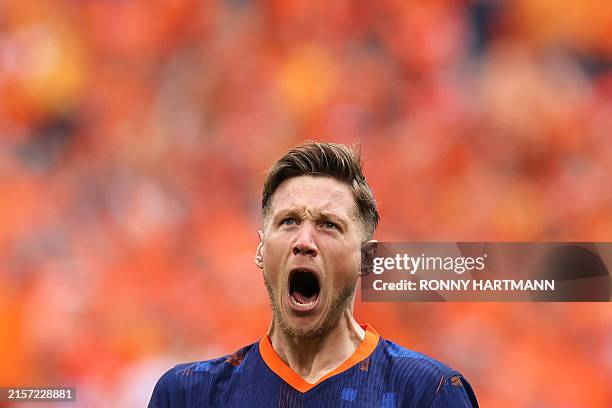 Netherlands' forward Wout Weghorst celebrates after scoring his team's second goal during the UEFA Euro 2024 Group D football match between Poland...