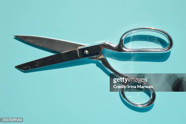 shiny big antique scissors - tijeras fotografías e imágenes de stock