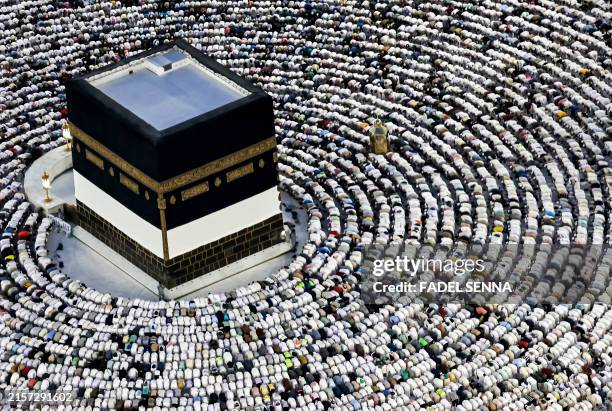 Muslim pilgrims pray around the Kaaba, Islam's holiest shrine, at the Grand Mosque in the holy city of Mecca on June 16 as they perform the farewell...