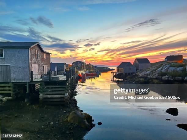 scenic view of sea against sky during sunset,peggys cove,nova scotia,canada - peggys cove stock-fotos und bilder
