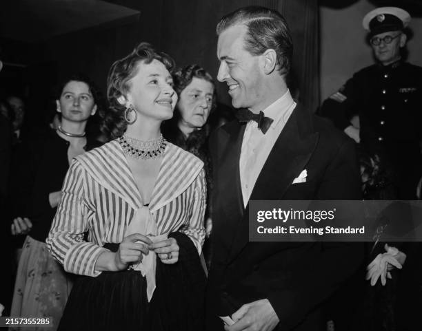 Actress Dulcie Gray with her husband, actor Michael Denison during a social event, August 21st 1954.