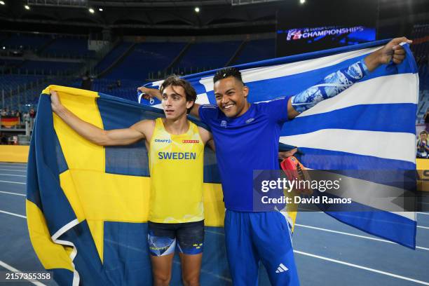 Silver medalist Emmanouil Karalis of Team Greece and Gold medalist Armand Duplantis of Team Sweden celebrate following the Men's Pole Vault Final on...