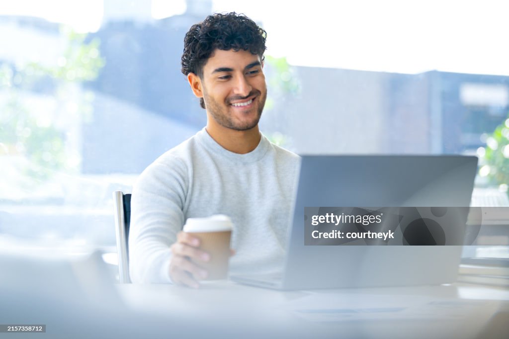 Businessman working on a laptop computer in the office.