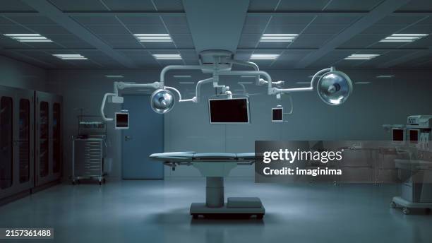fortschrittlicher chirurgischer operationssaal mit moderner ausstattung - operationstisch stock-fotos und bilder