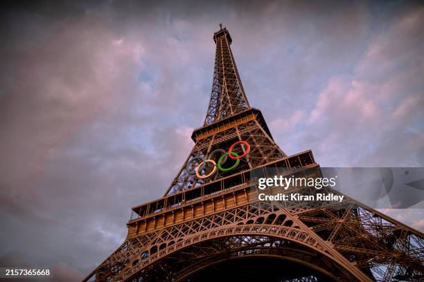 The Olympic rings are seen on the Eiffel Tower ahead of the start of the Paris 2024 Olympic Games on June 12, 2024 in Paris, France. The 2024 Summer...