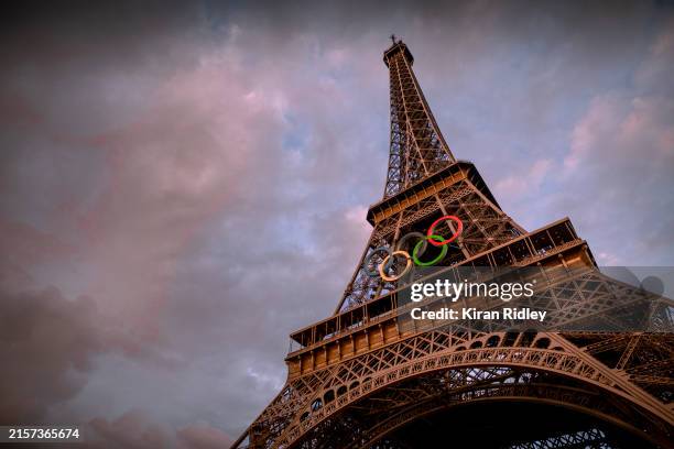 The Olympic rings are seen on the Eiffel Tower ahead of the start of the Paris 2024 Olympic Games on June 12, 2024 in Paris, France. The 2024 Summer...