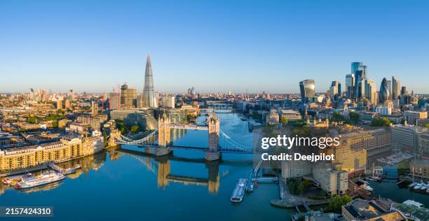 panoramic aerial view of tower bridge and the city of london at sunrise - tower-of-london-aerial stock pictures, royalty-free photos & images