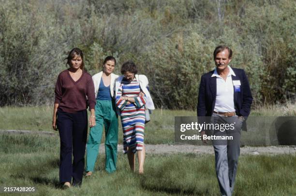 John Hemingway , son of writer Ernest Hemingway, walking near his home in Sun Valley with wife Byra and daughters Mariel and Margaux , Idaho, June...