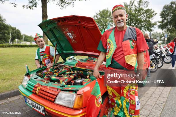Fan of Portugal poses at his car prior to the Portugal national football team arrival ahead of the UEFA EURO 2024 in Germany at Munster Osnabrueck...