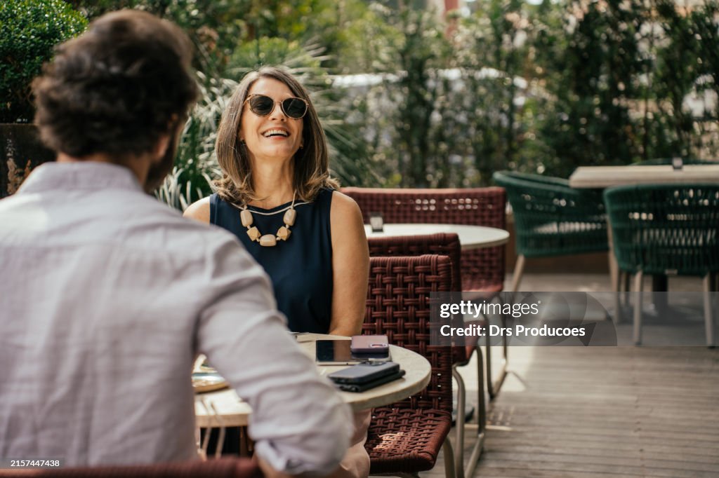 Couple eating outside at luxury hotel
