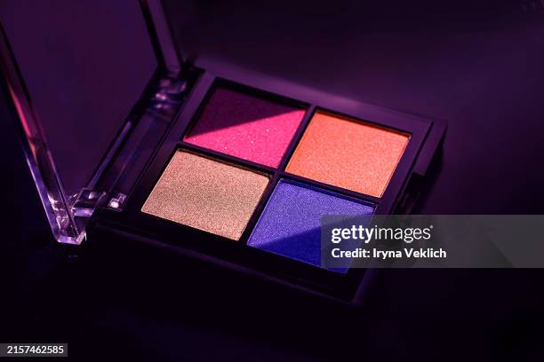 multicolor eyeshadow palette with matte texture on black color background. - paleta de maquillaje fotografías e imágenes de stock