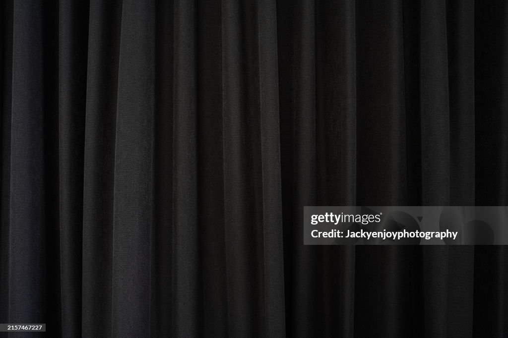 Background made of thick cloth from dark grey drapes. Background information for all texts.