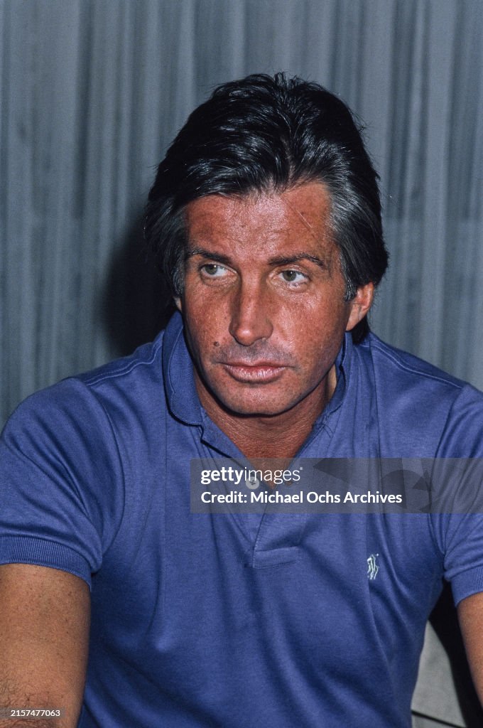 George Hamilton American actor George Hamilton, wearing a blue Ralph Lauren polo ...