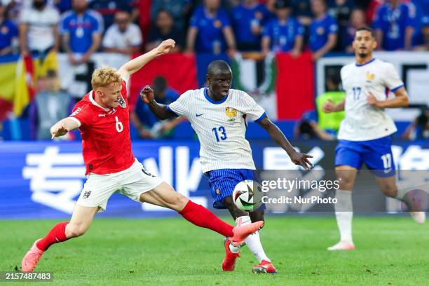 Nicolas Seiwald, N'Golo Kante are playing during the UEFA Euro 2024 Group D match between Austria v France, at the Düsseldorf Arena in Düsseldorf,...