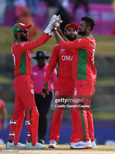 Bilal Khan of Oman celebrates taking the wicket of Phil Salt of England during the ICC Men's T20 Cricket World Cup West Indies & USA 2024 match...