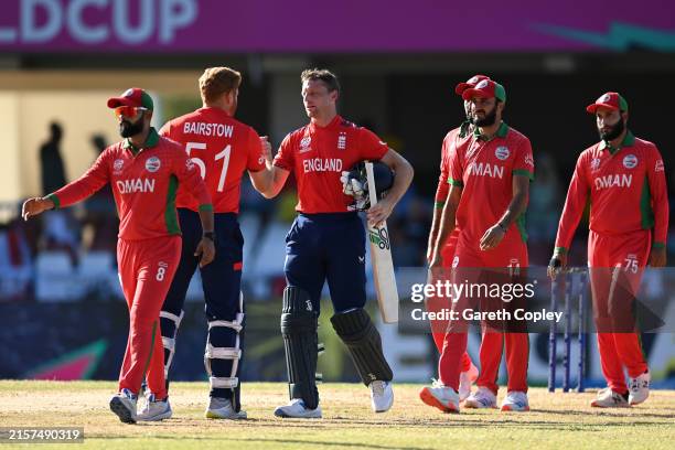 Jos Buttler and Jonny Bairstow of England celebrate victory during the ICC Men's T20 Cricket World Cup West Indies & USA 2024 match between England...