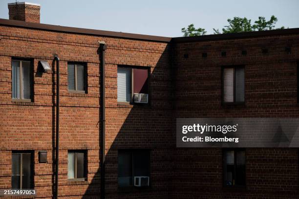 Air conditioning units installed in windows at an apartment complex in Hyattsville, Maryland, on Monday, June 17, 2024. While summer doesnt...