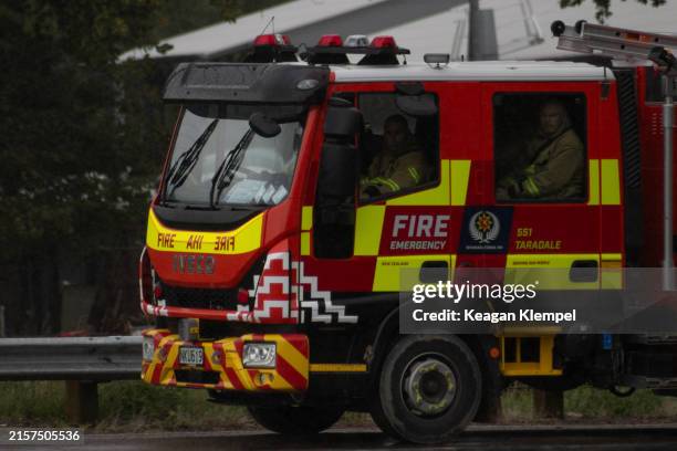 a fire engine and firefighters responding to cyclone gabrielle - fire engine stock pictures, royalty-free photos & images