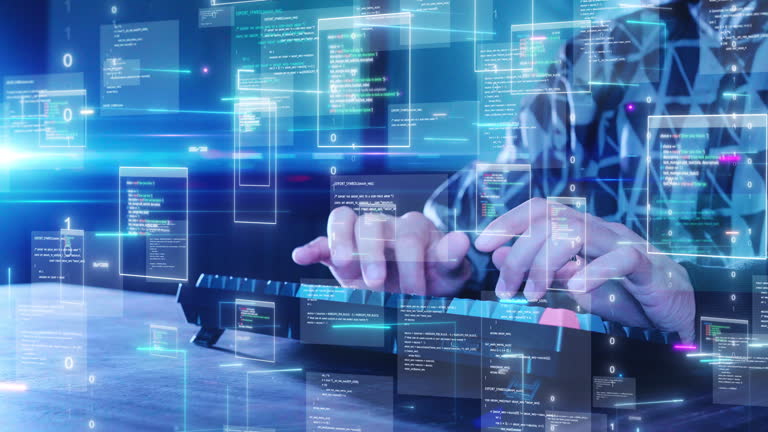 https://media.gettyimages.com/id/2157523436/video/software-developer-typing-on-a-keyboard-with-digital-codes-and-abstract-programming-languages.jpg?b=1&s=640x640&k=20&c=Y0uHsFFvcbBJXRfopT-L3zUKOLBJCOs5UG9u-EsdJRk=