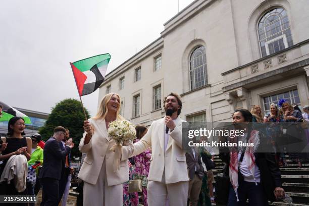 Newlywed couple outside Hackney Town Hall surrounded by friends, family and pro-Palestinian activists on the 15th of June 2024, London, United...