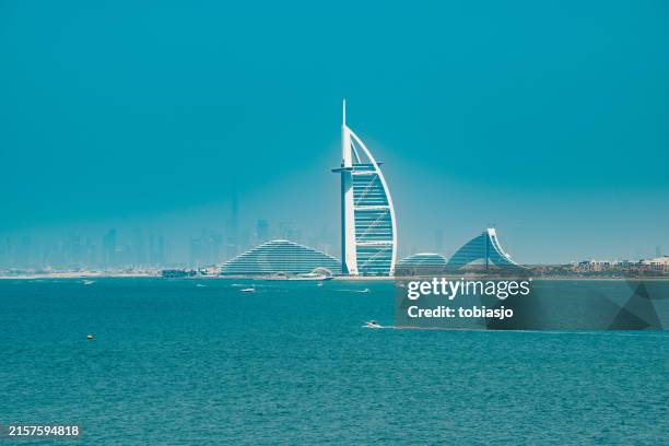 dubai skyline and the persian gulf - burj al arab beach stock pictures, royalty-free photos & images