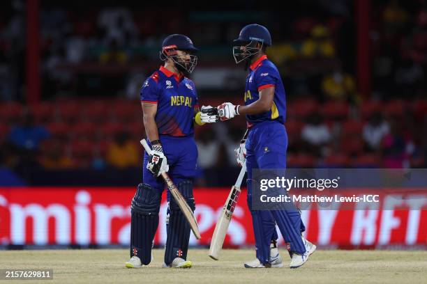 Kushal Bhurtel and Aasif Sheikh of Nepal fist bump during the ICC Men's T20 Cricket World Cup West Indies & USA 2024 match between South Africa and...