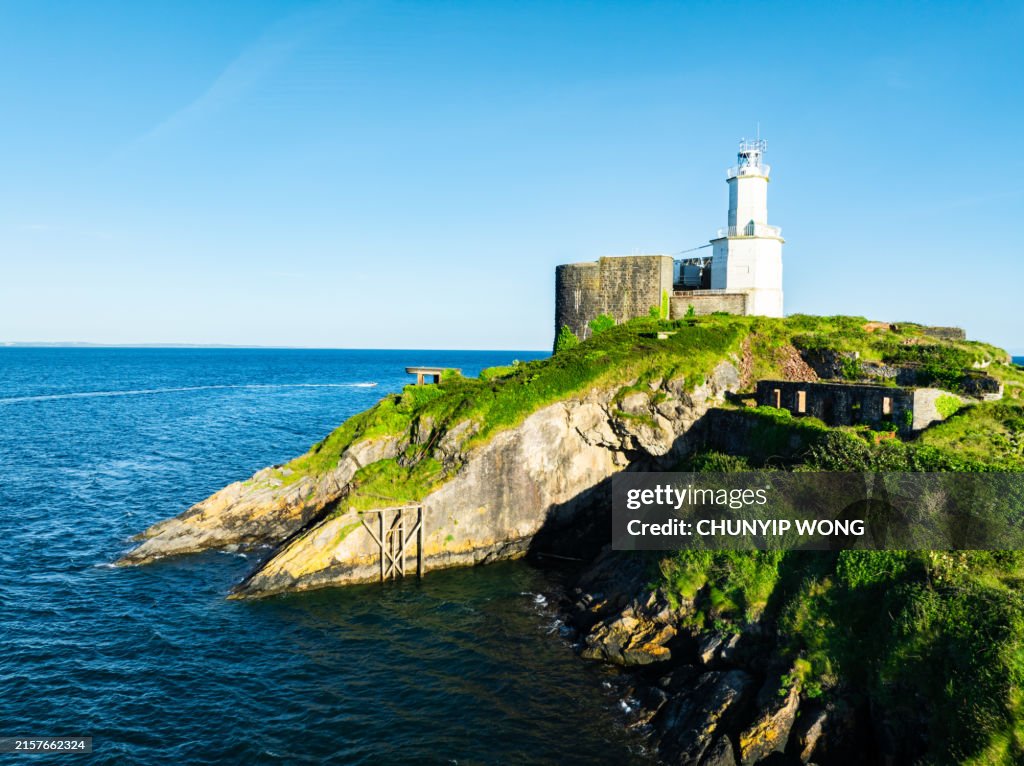 Aerial photography of Mumbles Lighthouse at Bracelet Bay in Wales