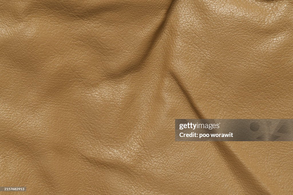 Light brown leather fabric texture.