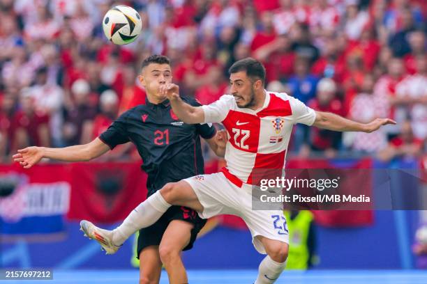 Kristjan Asllani of Albania and Josip Juranovic of Croatia in action during the UEFA EURO 2024 group stage match between Croatia and Albania at...