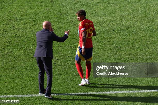 Lamine Yamal of Spain receives instructions from Luis de la Fuente, Head Coach of Spain, during the UEFA EURO 2024 group stage match between Spain...