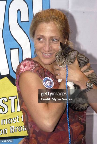 Edie Falco holds a kitten as she attends the 5th Annual Broadway Barks July 12, 2003 at Shubert Alley in New York City. Broadway Barks assists New...