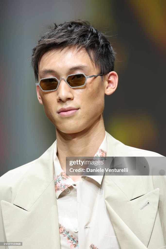 A model walks the runway at the Emporio Armani fashion show during A model walks the runway at the Emporio Armani fashion show during