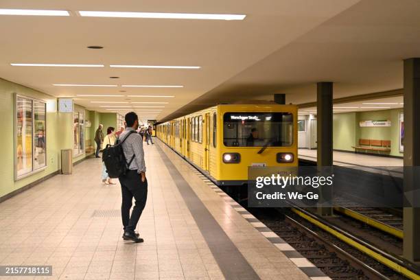 passengers waiting for the subway at kurfürstendamm station - kurfürstendamm stock pictures, royalty-free photos & images