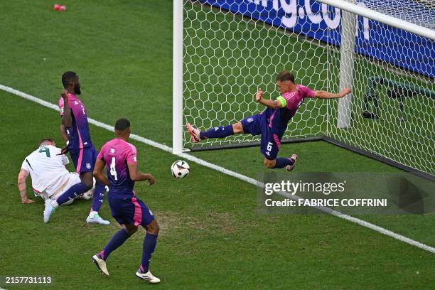 Germany's defender Joshua Kimmich makes a goal-line clearence during the UEFA Euro 2024 Group A football match between Germany and Hungary at the...