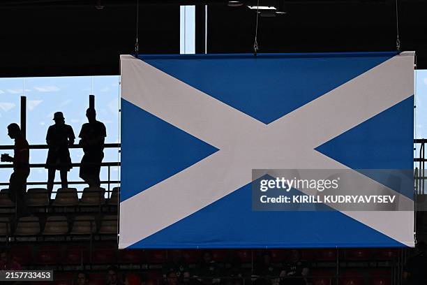The flag of Scotland is displayed in a tribune as spectators wait for the start of the UEFA Euro 2024 Group A football match between Scotland and...