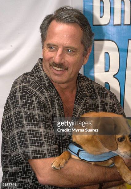 Tom Wopat poses with a puppy at the 5th Annual Broadway Barks 5. Broadway Barks assists New York animal shelters in their mission to find "homeless"...