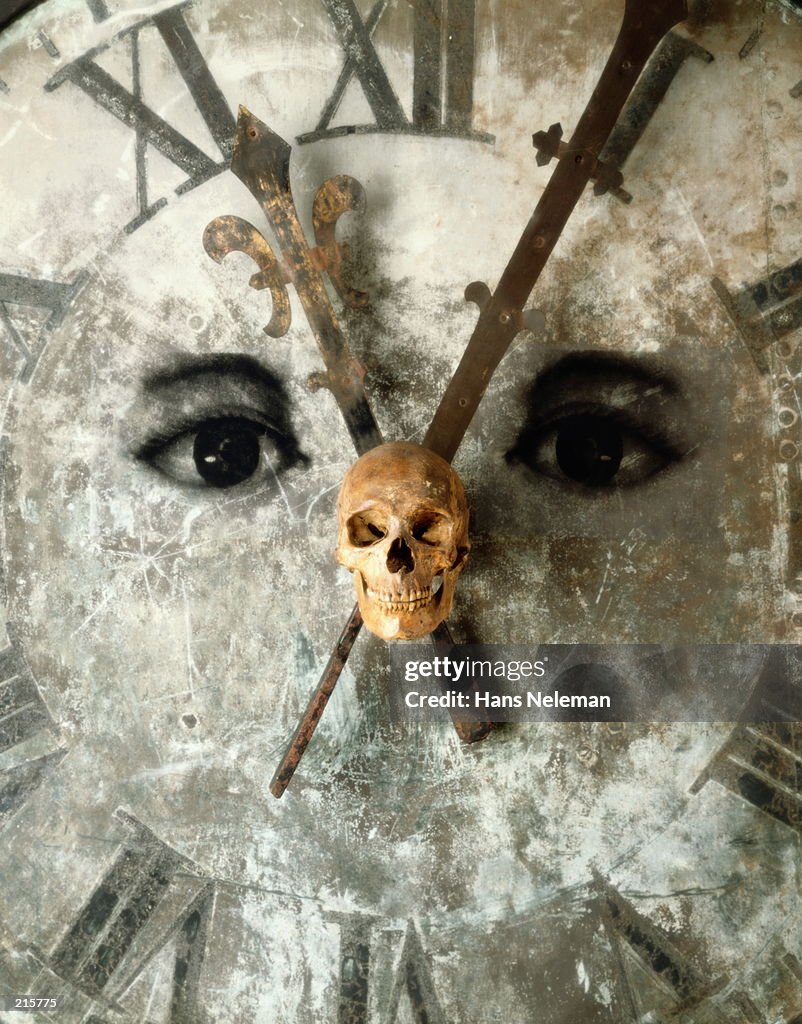 CLOCK FACE WITH EYES & SKULL