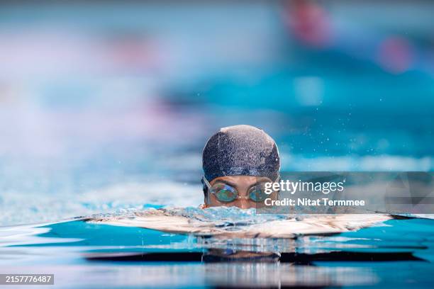swimming into your routine, you may maintain or increase your lung capacity, joint, and heart health. - schwimmwettkampf stock-fotos und bilder