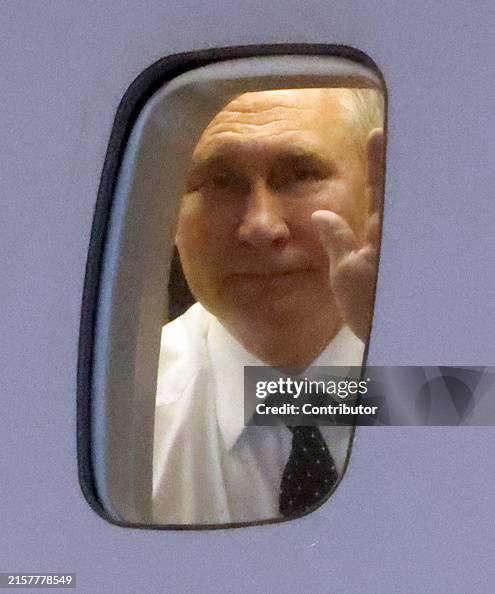 Putin Wave Russia's President Vladimir Putin waves from the plane during a... News ...