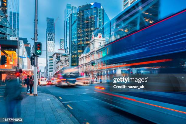 city in motion. - long exposure stock pictures, royalty-free photos & images